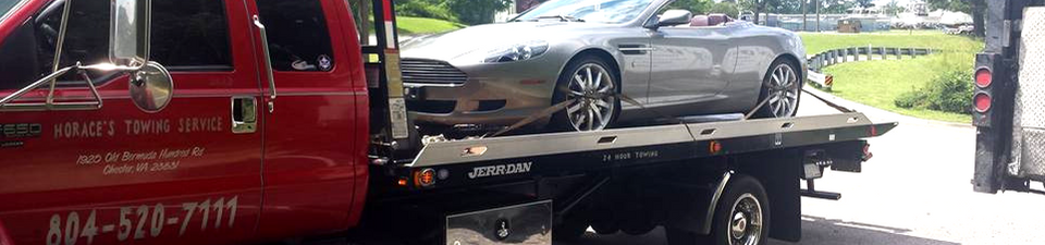 a silver car being towed